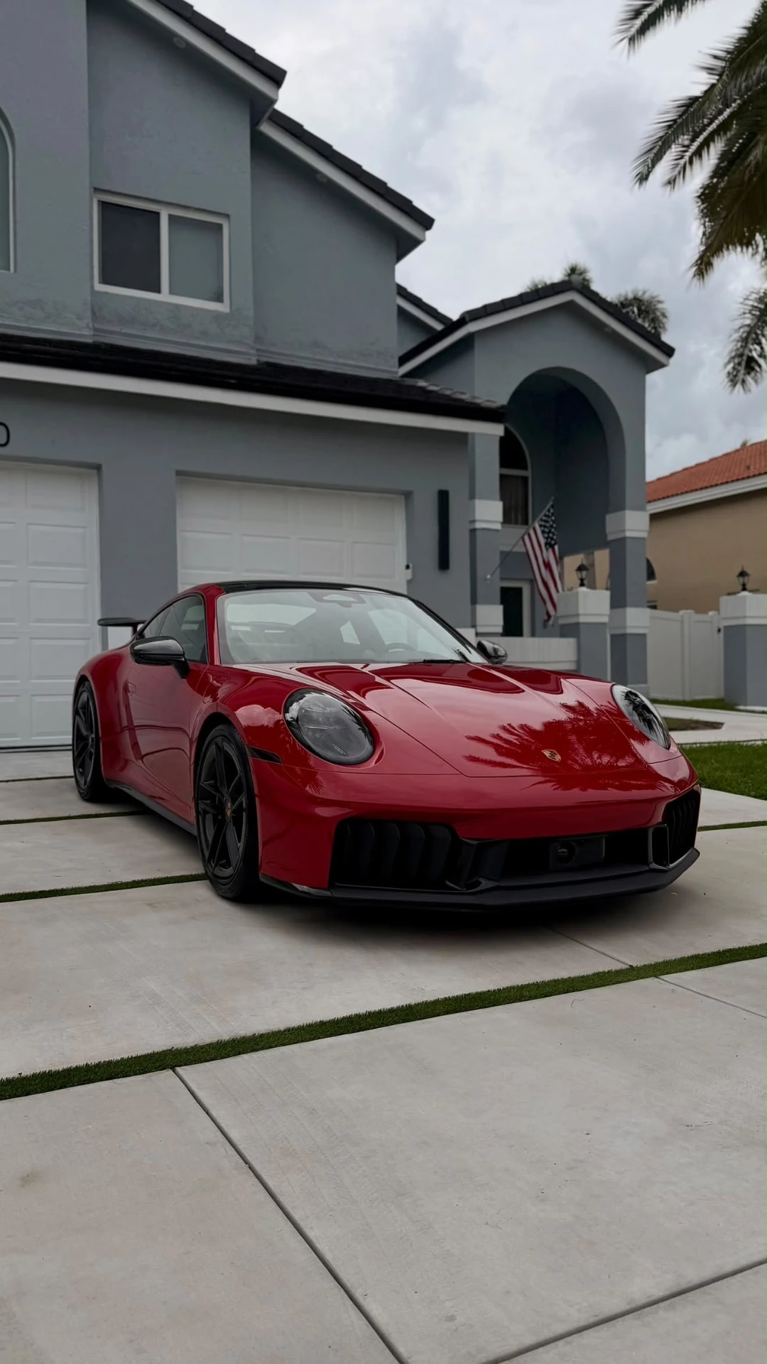 Finished red Porsche on a Miami driveway